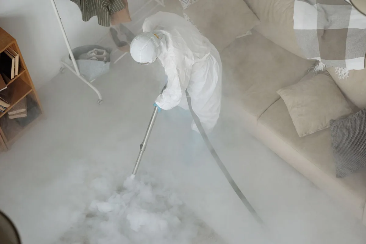 Biohazard cleanup technician in protective equipment, Romney, WV